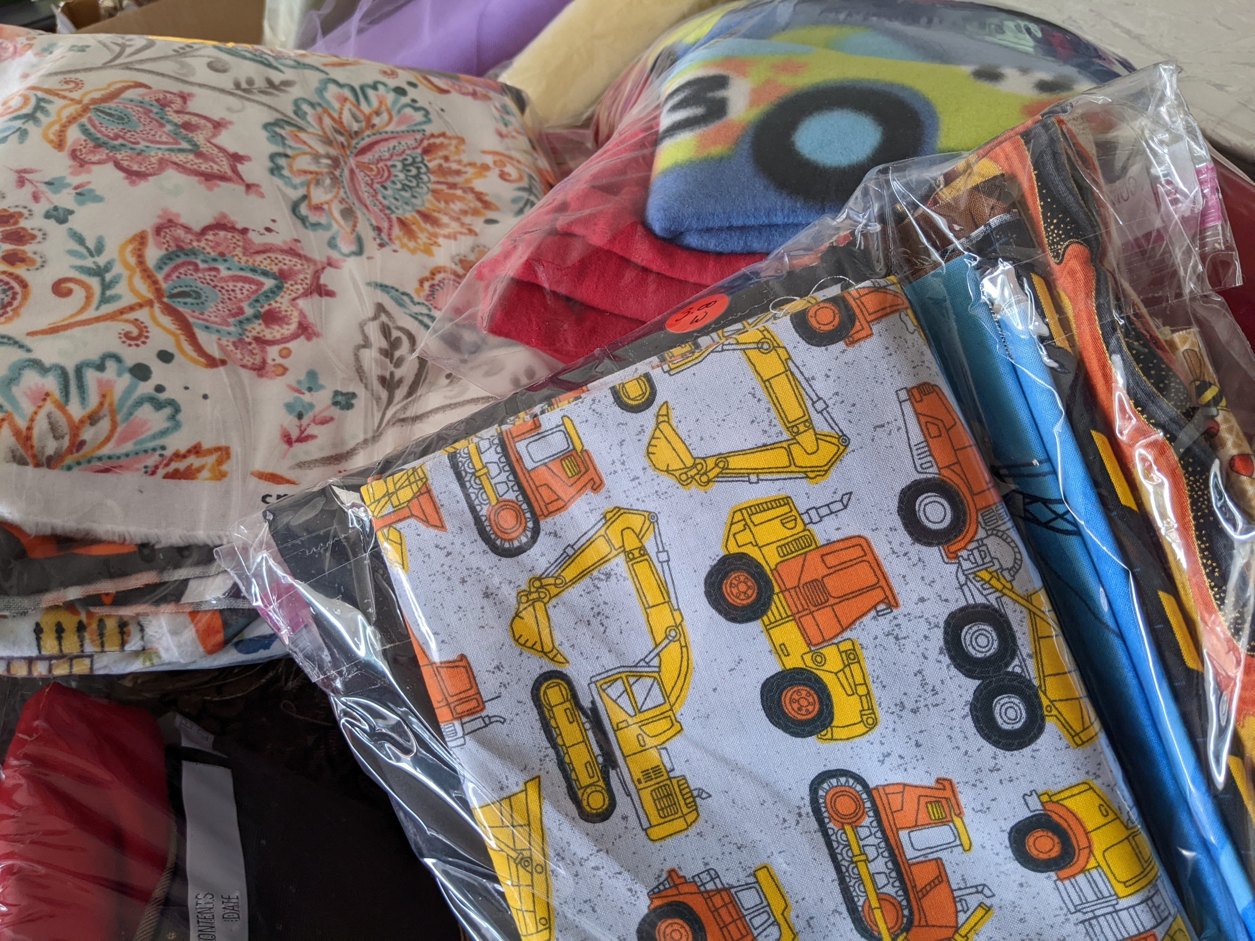 Sell things grouped together in grab bags at a garage sale.