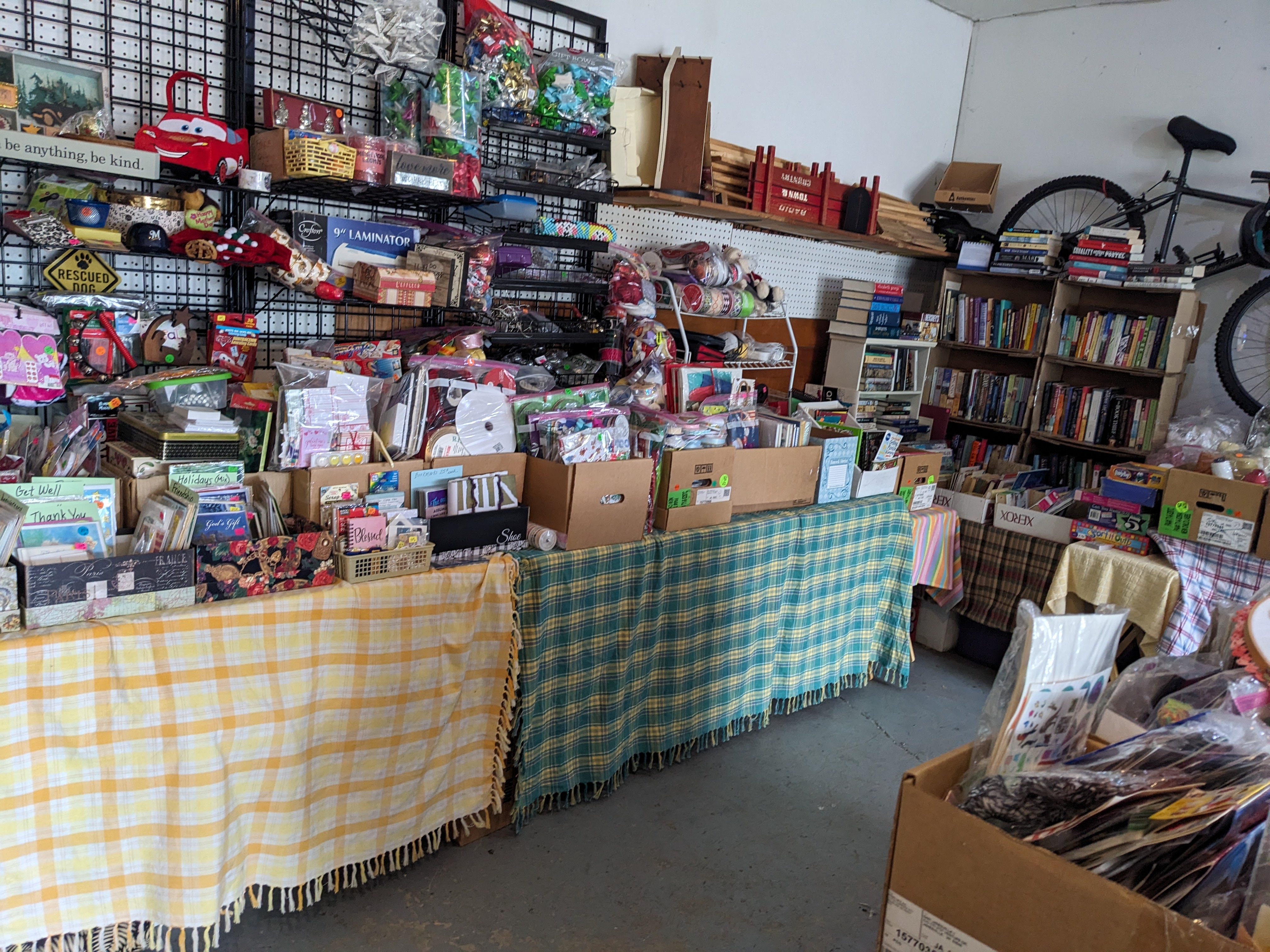 Rummage sale set-up tips using shelves and boxes on tables.
