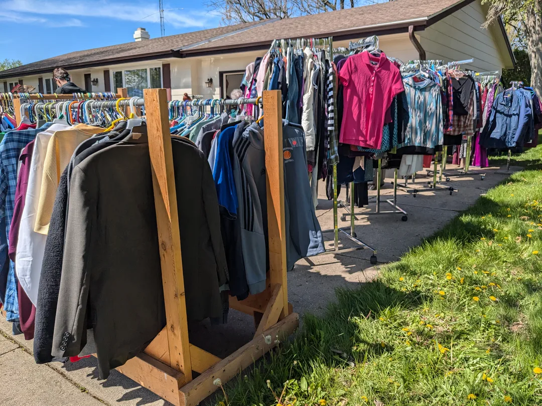 Hang clothes to maximize space at your yard sale.